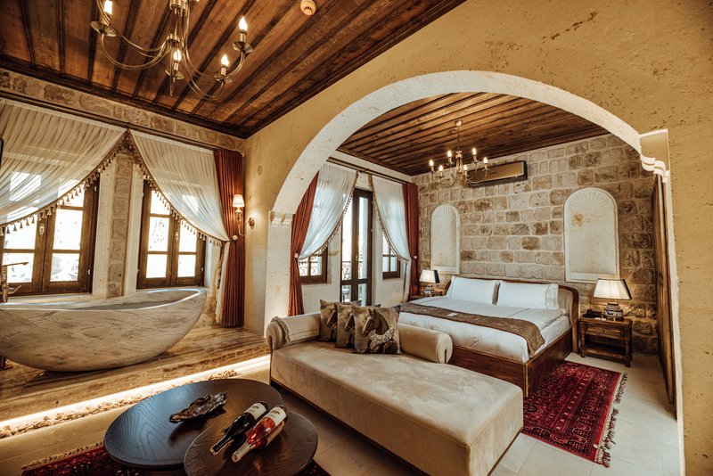 Stone Arched Honeymoon Suite - Bedroom & Living Area