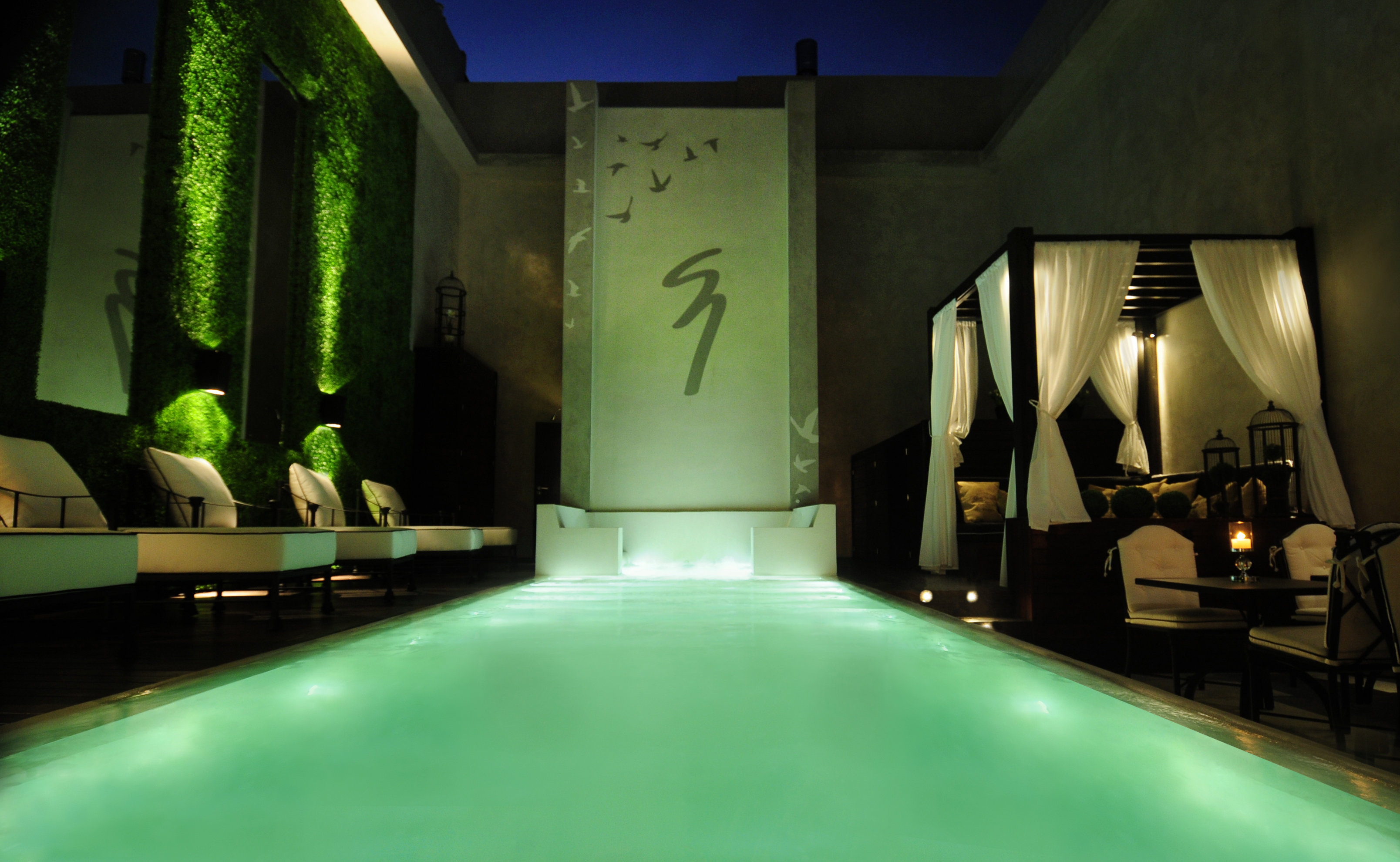 Illuminated heated pool and cascade