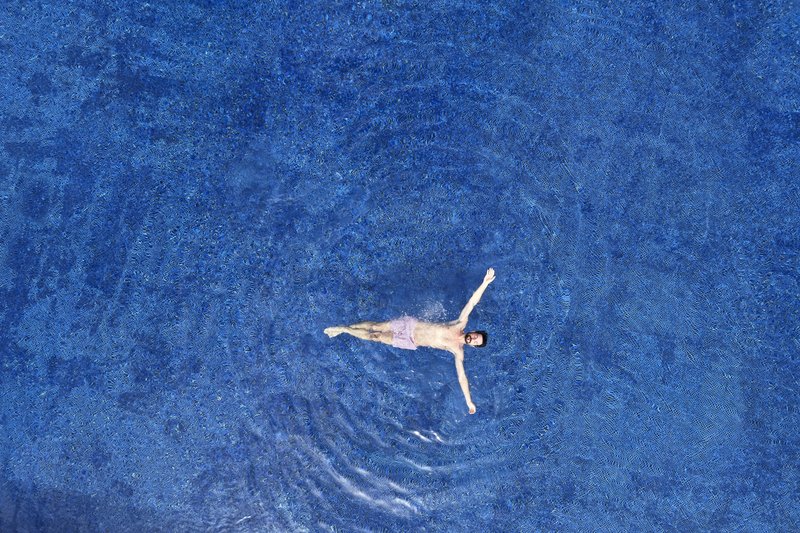 Aerial Minos Beach Man In The Pool