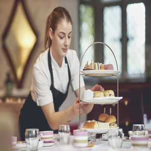 Pastry Chef putting the finishing touches to Afternoon Tea