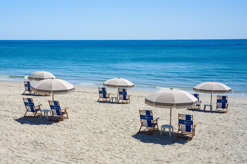 Blue Ocean With Chairs On The Beach